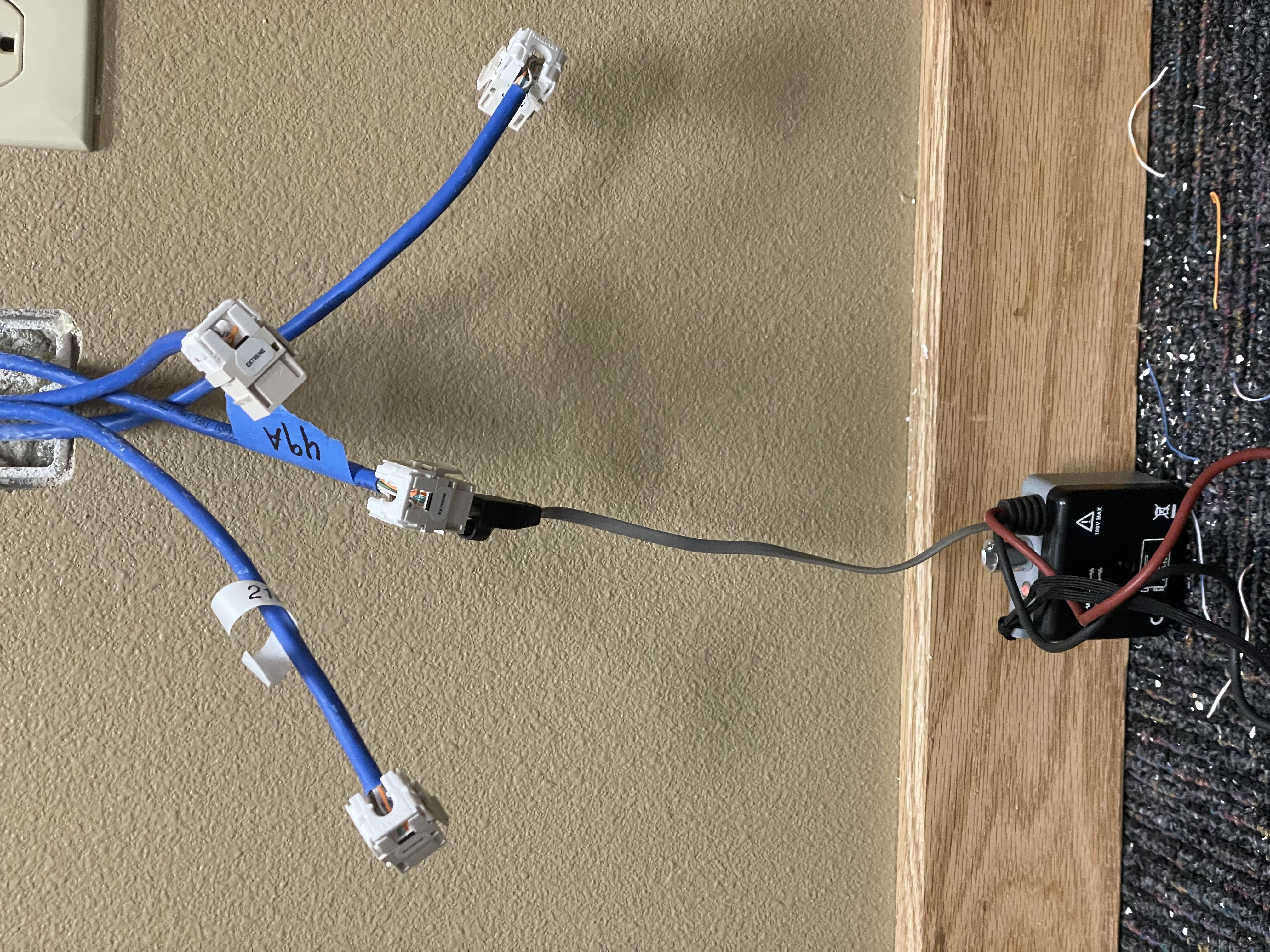 Cable toner device connected to a wire from a wall port